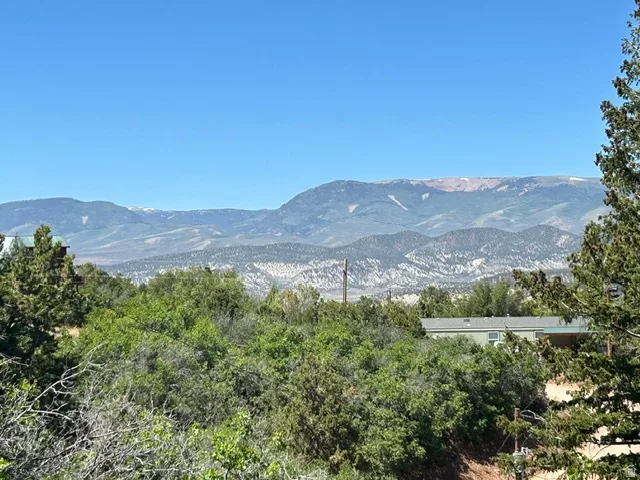 Mountain landscape featuring distant peaks and a clear sky