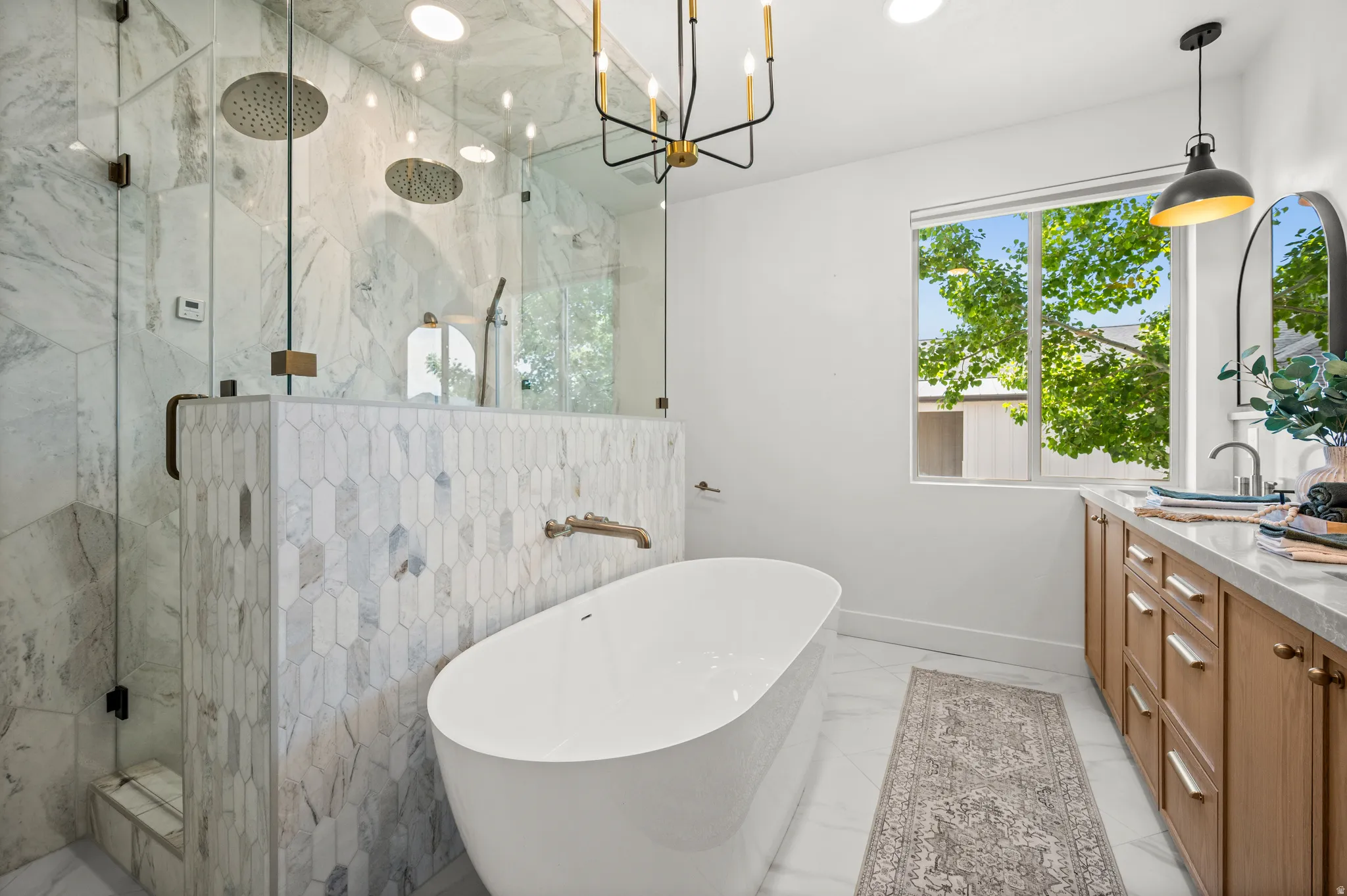 Your private retreat awaits, featuring a luxurious steam shower, soaking tub, double vanities, and abundant storage.