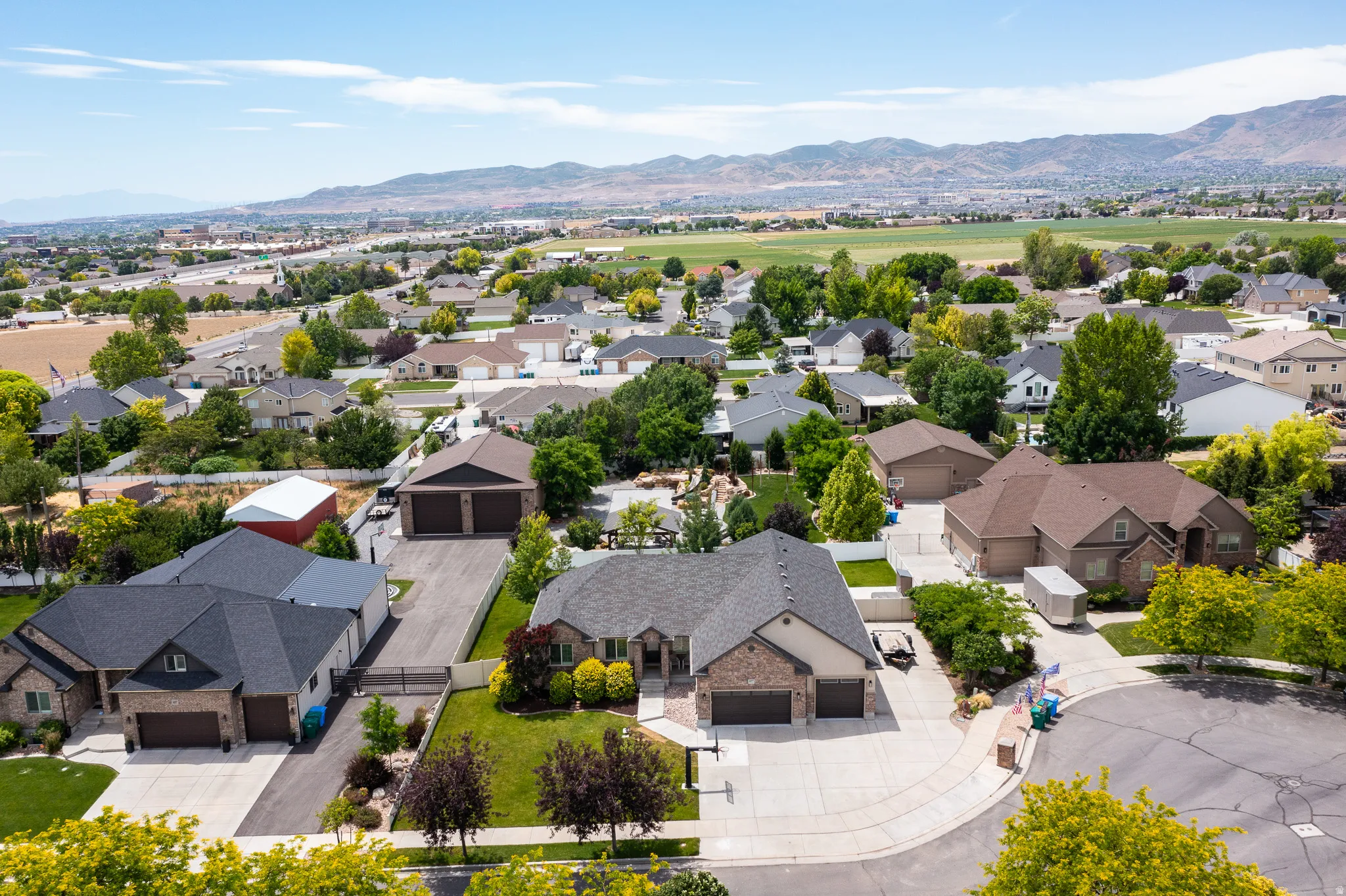 Take in the full beauty of this property from above, where the expansive lot, RV parking, covered patio, and outdoor living spaces come together perfectly.