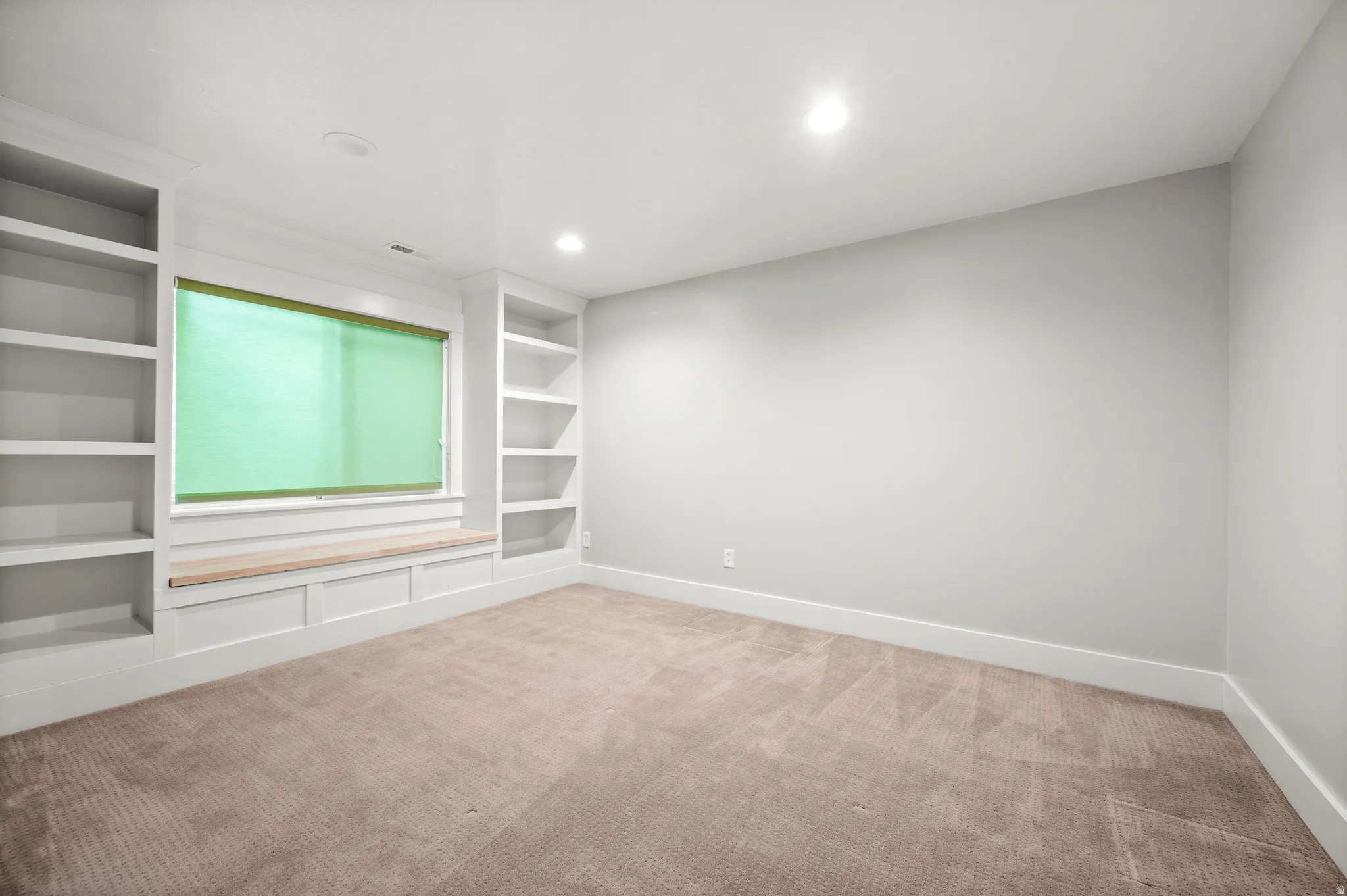 A true standout, this bedroom offers custom built-in bookshelves, a walk-in closet, and plenty of space to make it your own.