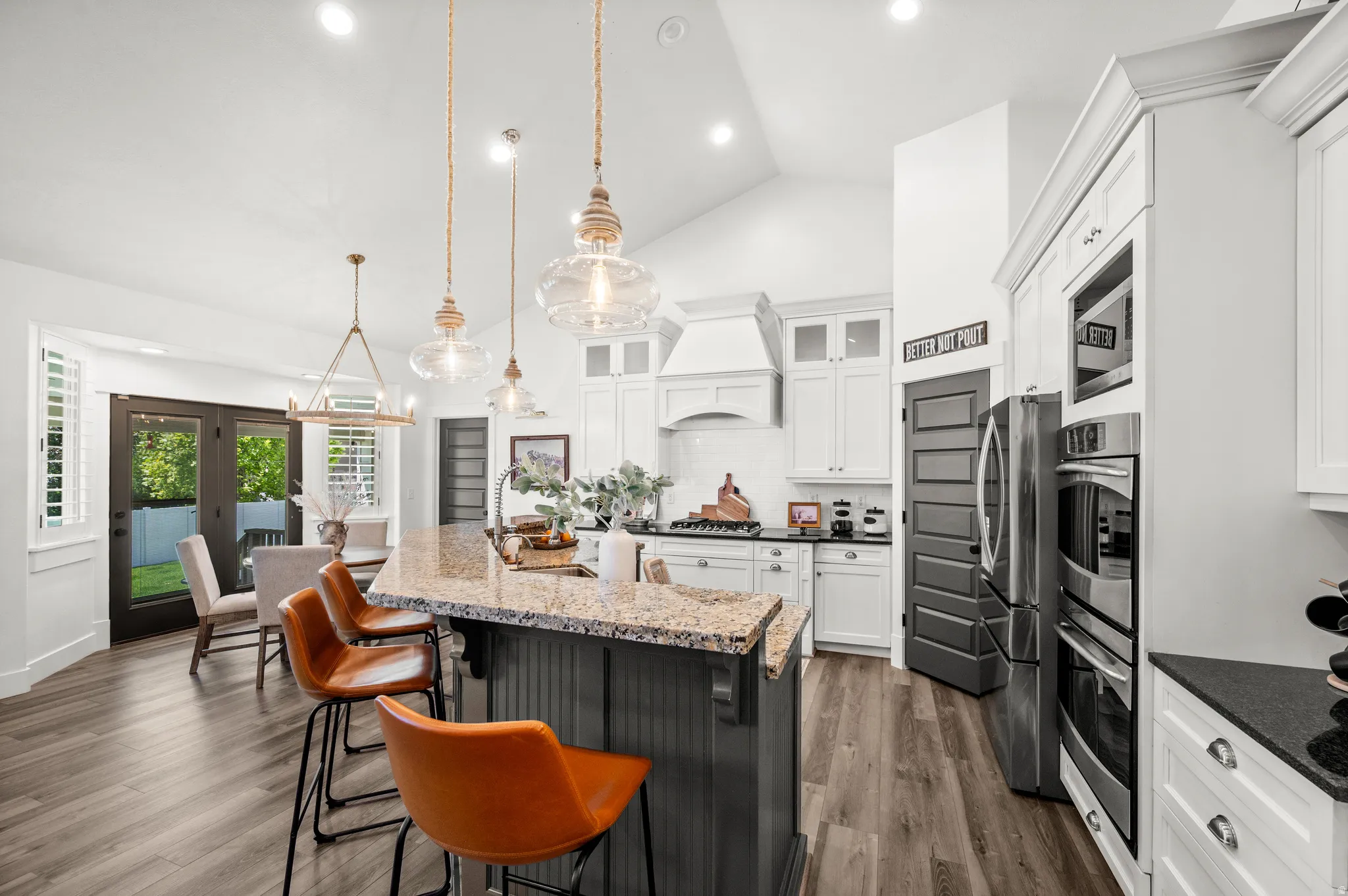Thoughtfully designed for everyday living and entertaining, the island bar and kitchen nook are sure to become favorite gathering spaces.