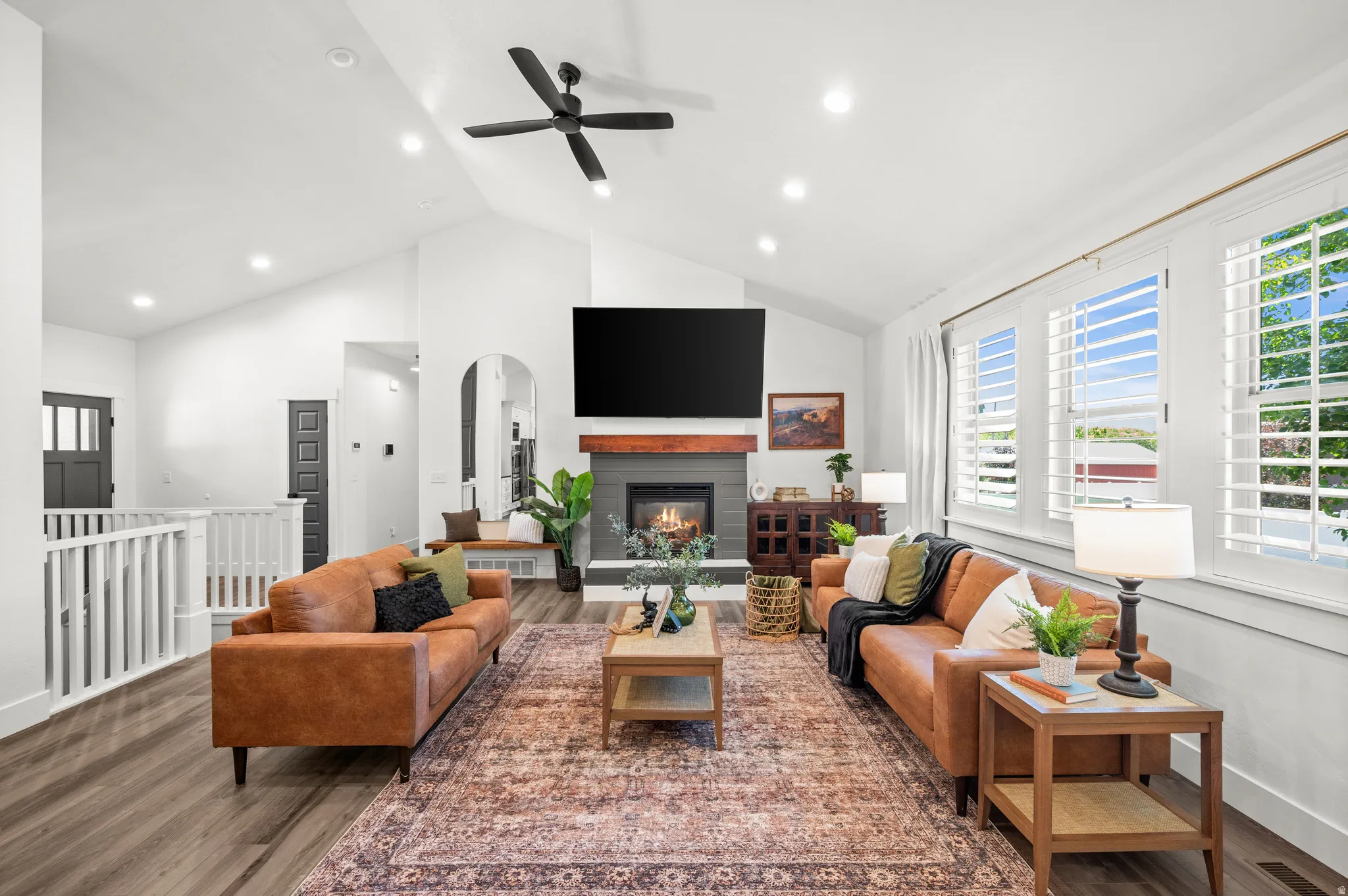 The beautiful fireplace serves as the centerpiece of the room, creating a warm and inviting space for family and friends to gather.