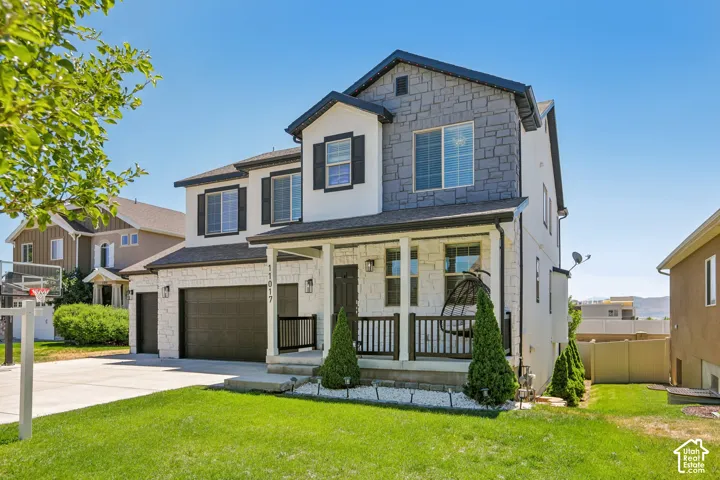 Contemporary two-story residence featuring a stone and stucco exterior