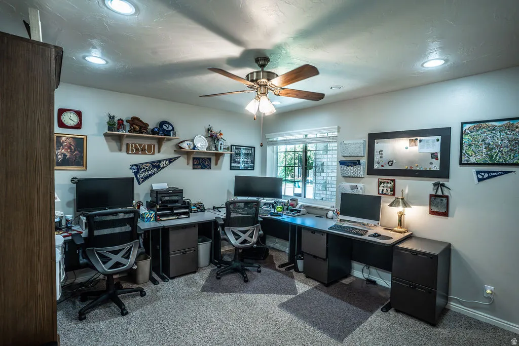 Room featuring neutral wall tones, recessed lighting, and a ceiling fan with light fixture