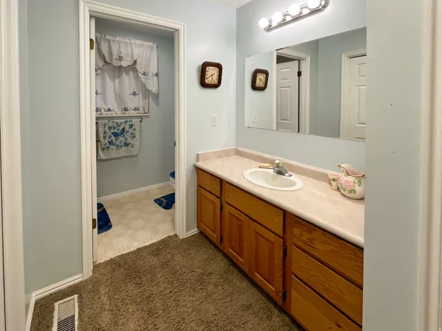 Vanity with a laminate countertop and an integrated sink