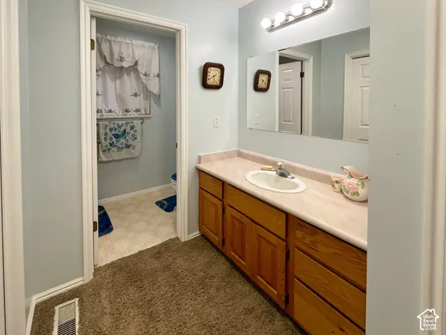 Vanity with a laminate countertop and an integrated sink