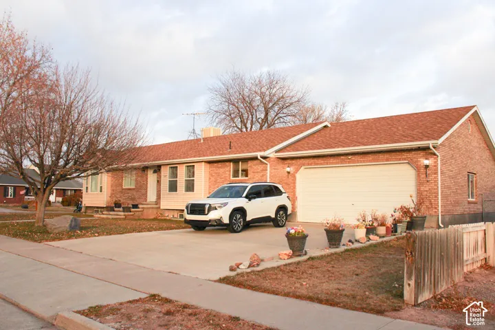 Single-story residence featuring a brick and siding exterior