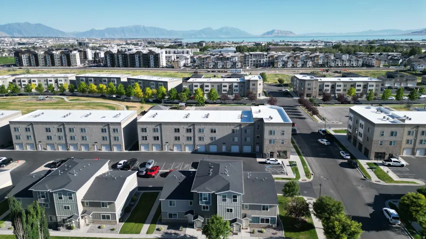 Aerial perspective showcasing a residential community with multi-story buildings and townhomes
