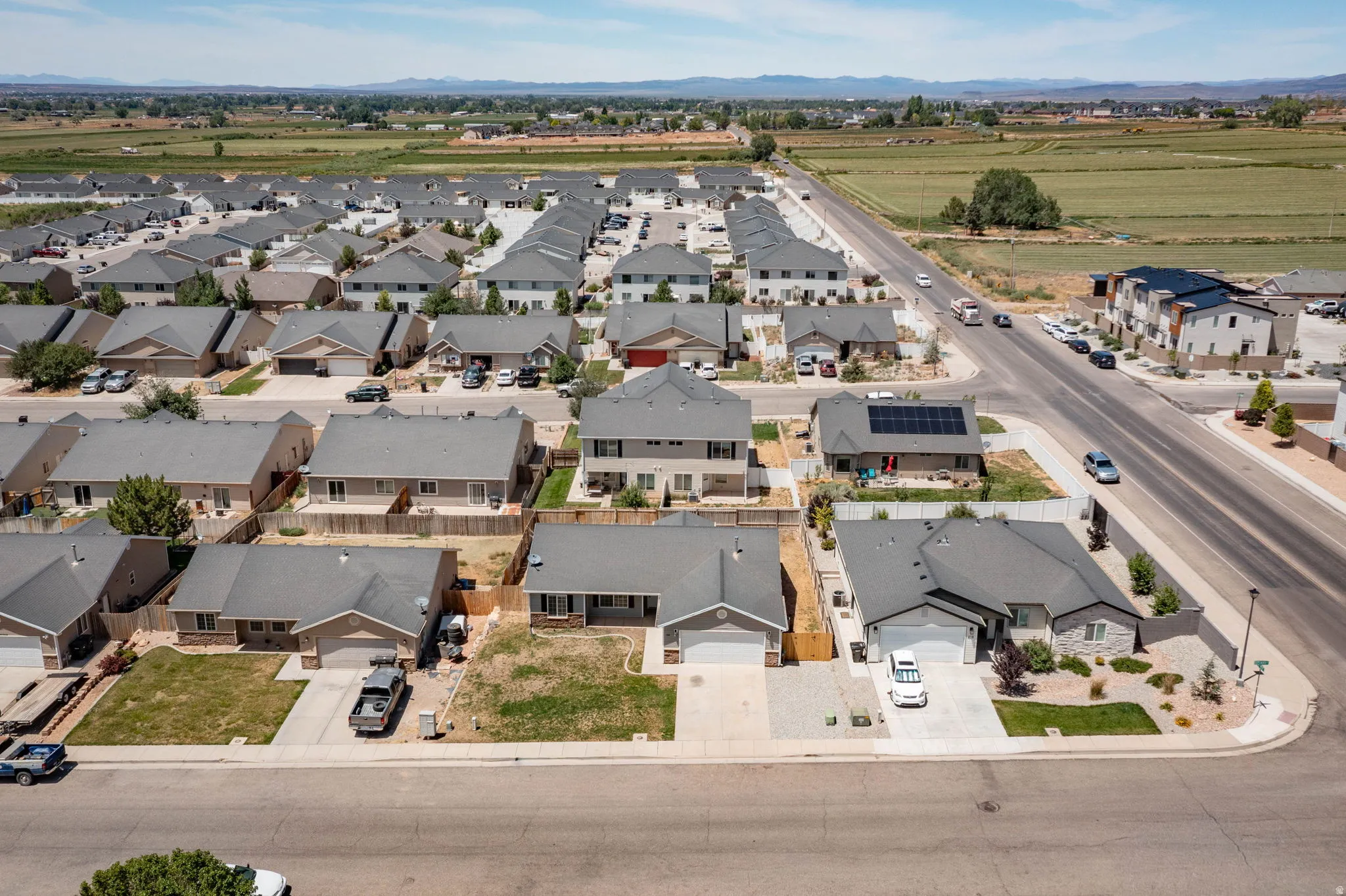 Aerial perspective showcasing a residential community with a variety of single-story and two-story homes