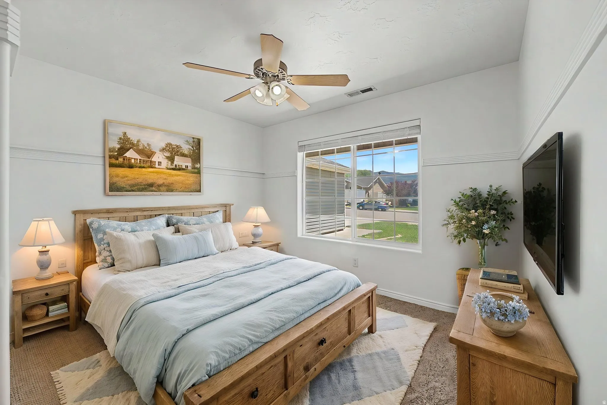 Bedroom featuring a wood-finish bed frame, wood-finish nightstands, and a wood-finish dresser