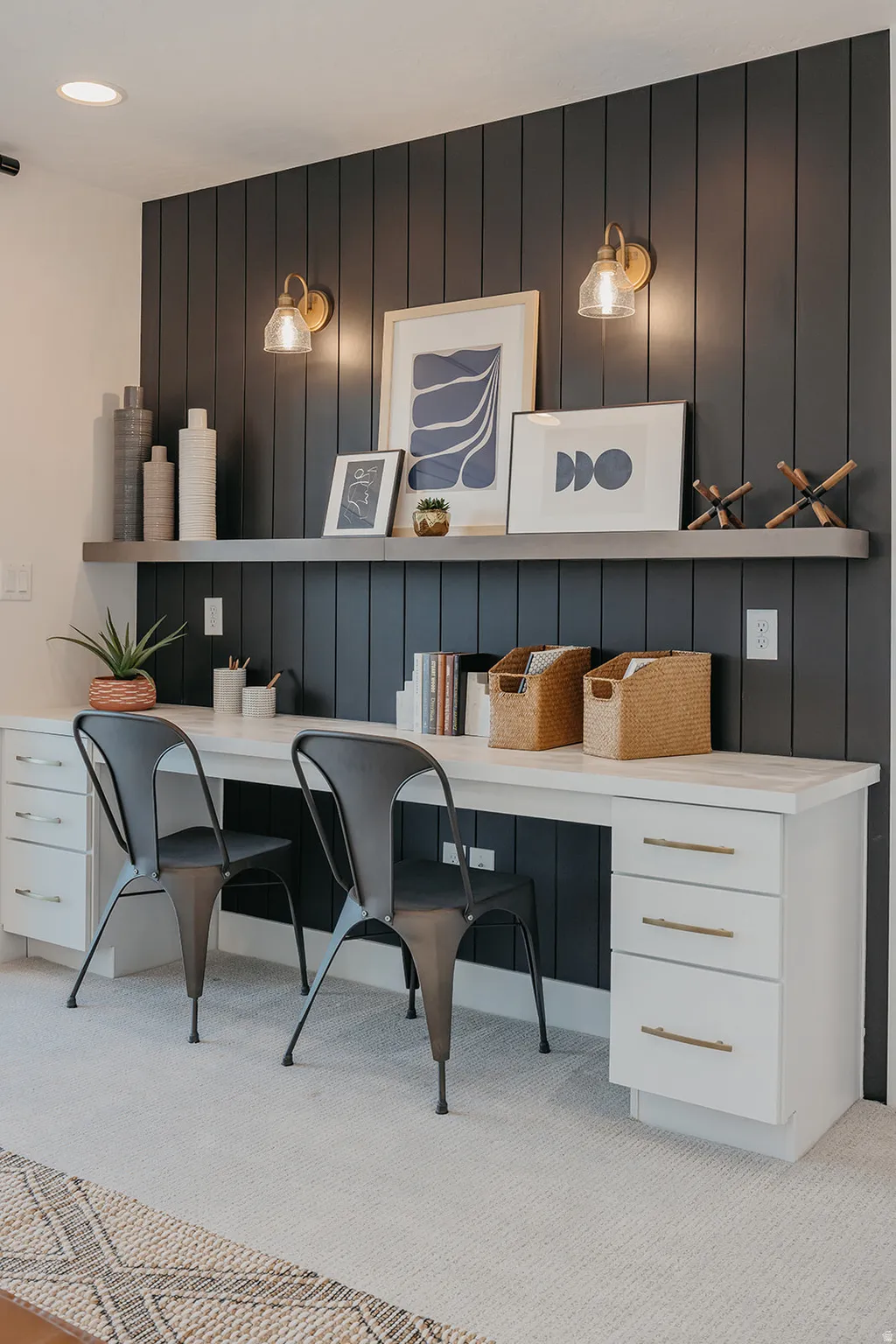 Built-in double desk with white cabinetry and a light-toned countertop