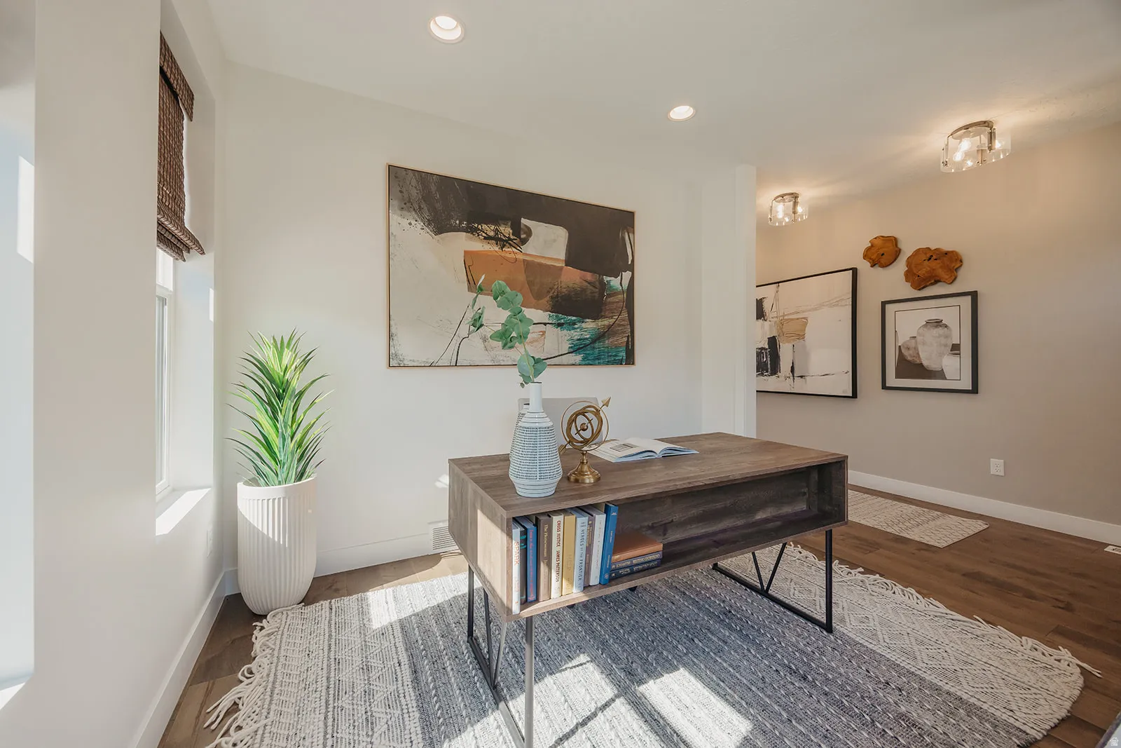 Bright interior space featuring wood-finish flooring and recessed lighting