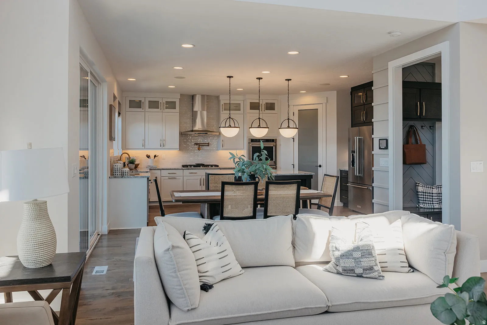 Open-concept living space featuring wood-finish flooring
