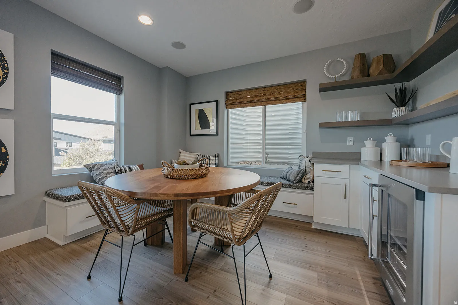 Built-in window bench seating with storage drawers, complemented by wood-finish flooring