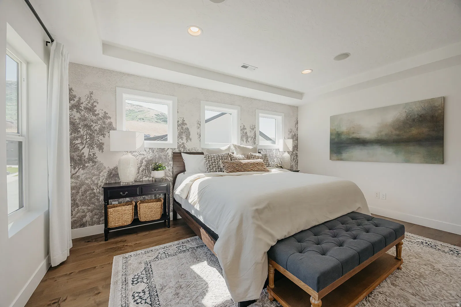 Interior room featuring wood-finish flooring, a tray ceiling, and recessed lighting
