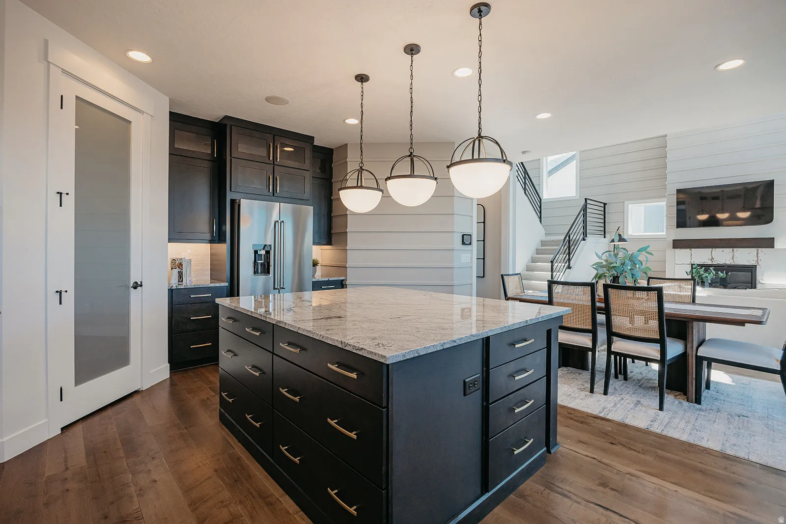Spacious kitchen island featuring a light-toned countertop and ample storage