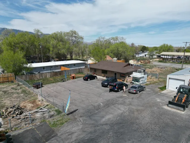 Asphalt parking lot with visible parking spaces