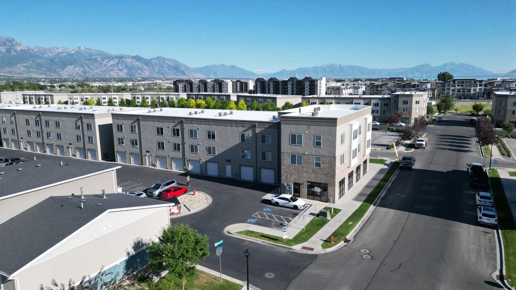 Modern multi-story buildings featuring varied facades and numerous windows