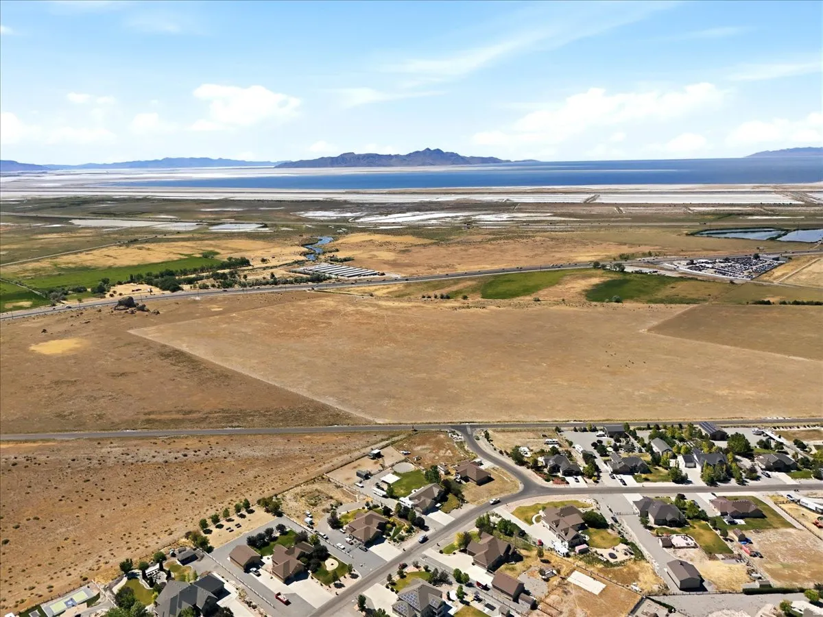 Expansive land parcel with surrounding residential development and agricultural fields