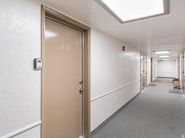 Entry door with brass hardware and numerical designation