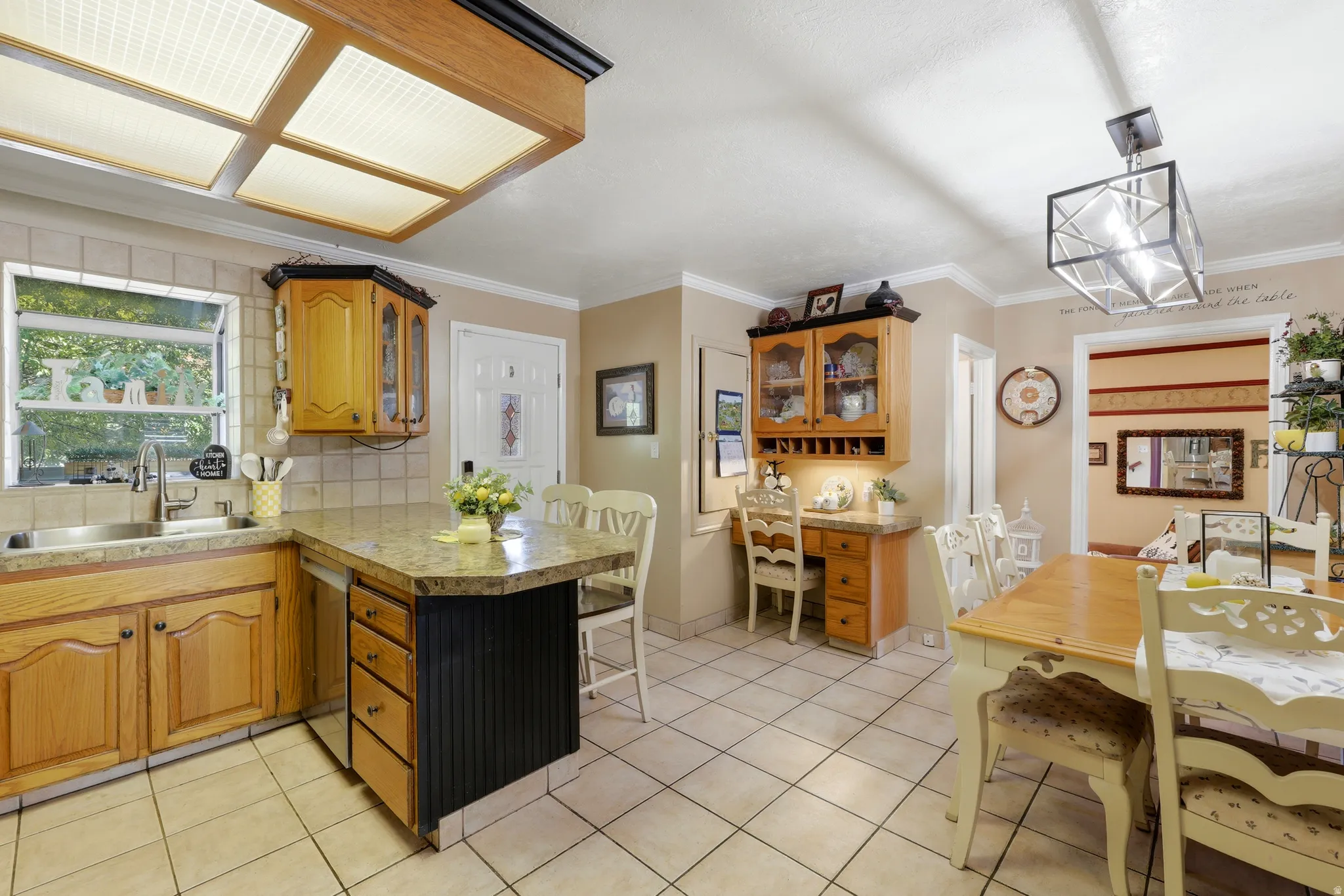 Tiled flooring extending throughout the kitchen and dining areas