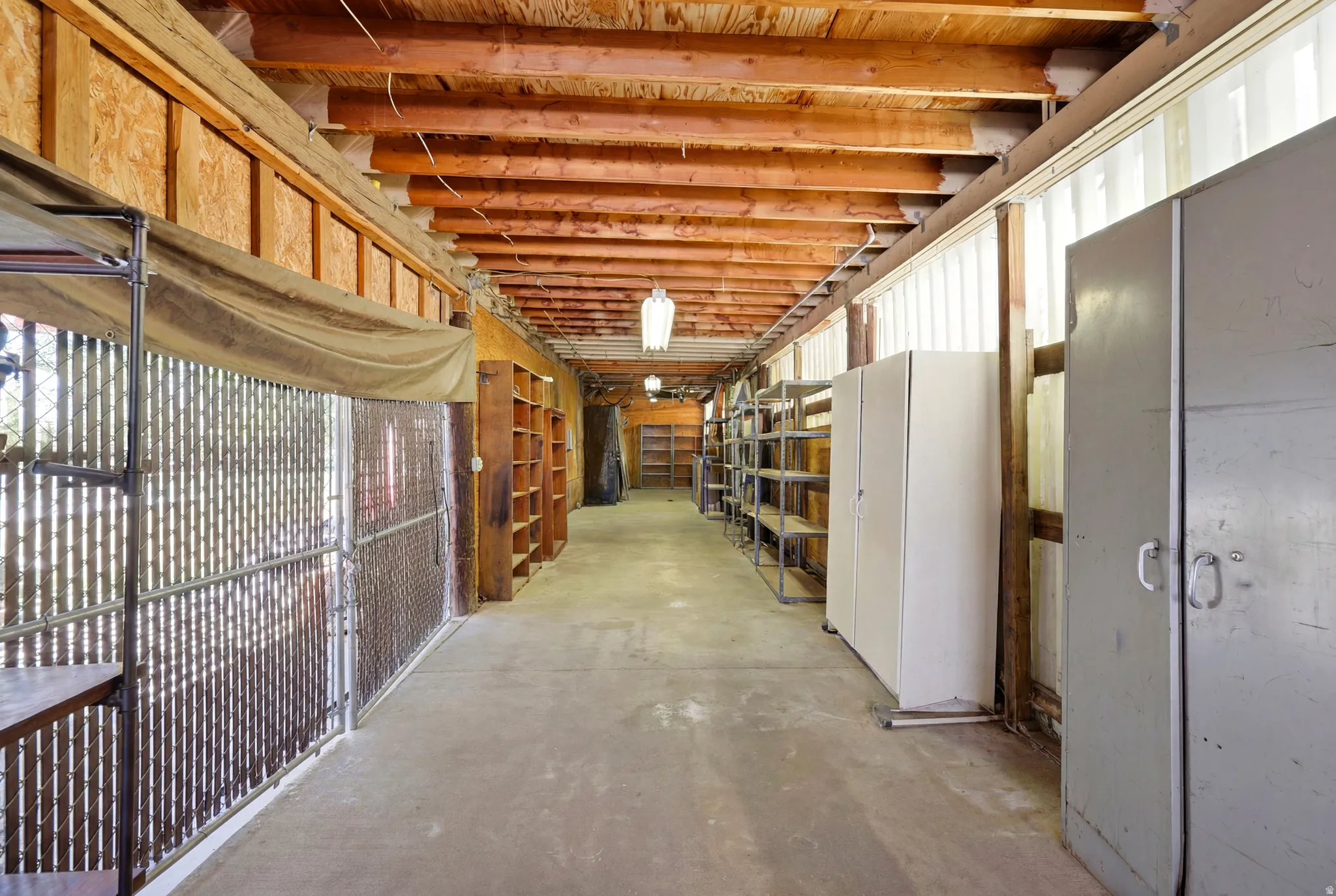 Exposed wood beam ceiling over a concrete floor