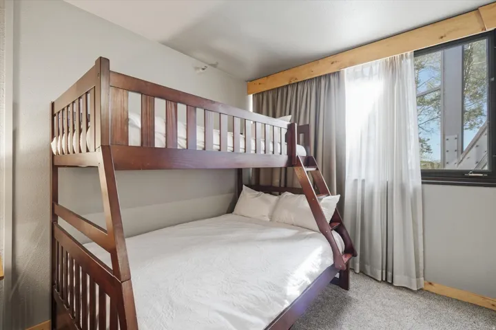 Solid wood bunk beds feature a built-in ladder