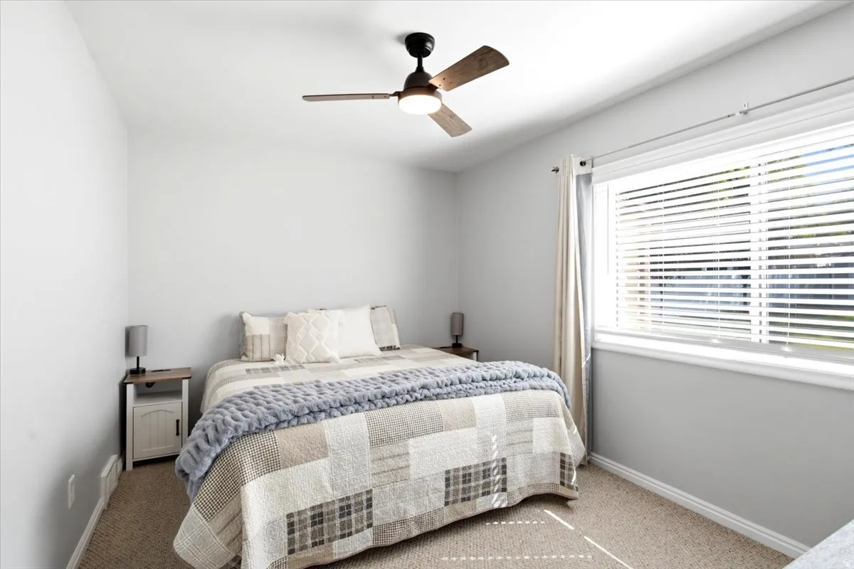 Nice bedroom with large brand new window overlooking nice backyard.