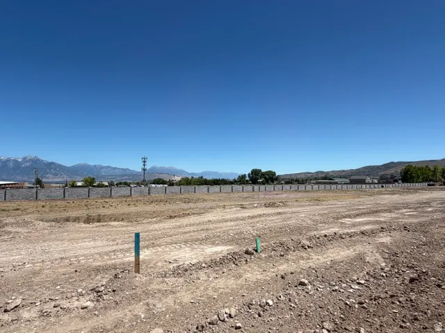 Expansive cleared lot with a distant mountain backdrop