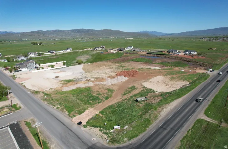 Expansive undeveloped land parcel with direct paved road frontage