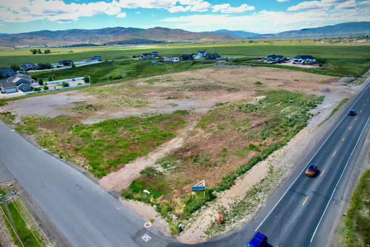 Expansive undeveloped land parcel featuring existing road frontage