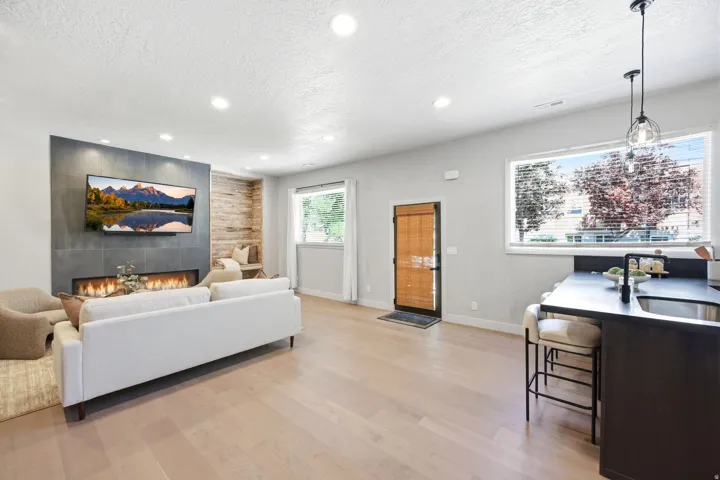 Open-concept living area featuring light wood-finish flooring throughout