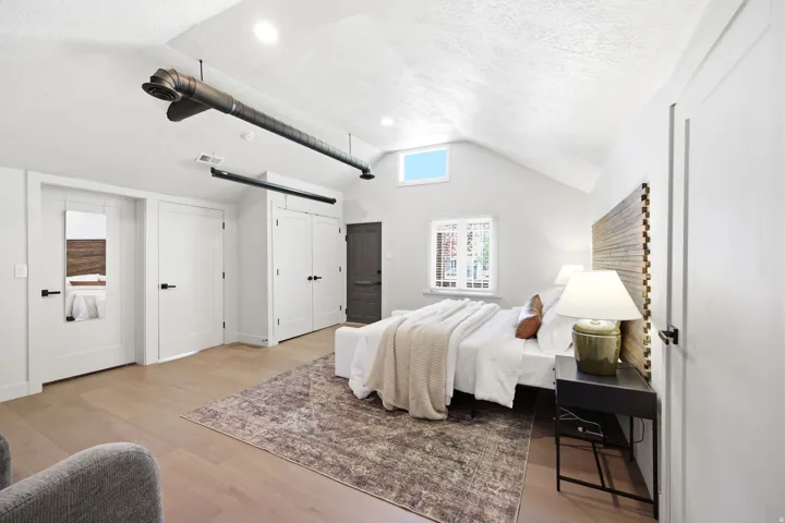 Vaulted ceiling with exposed ductwork and recessed lighting