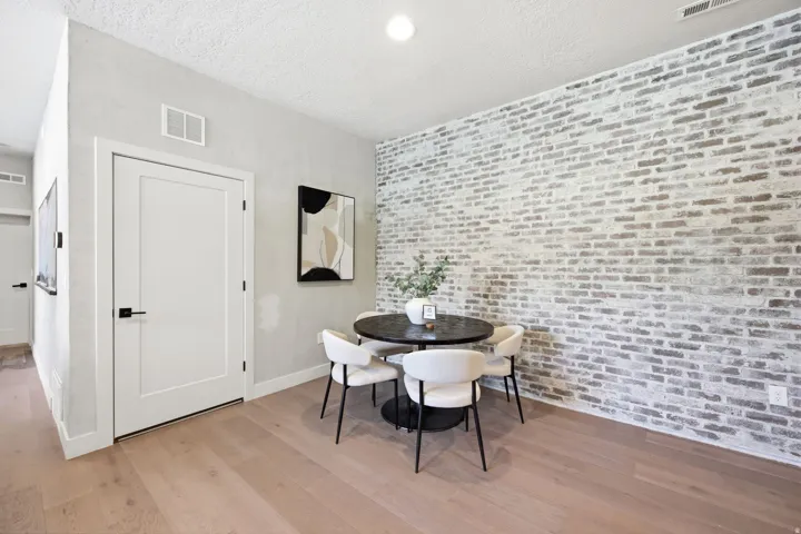 Accent brick wall featuring a distressed finish