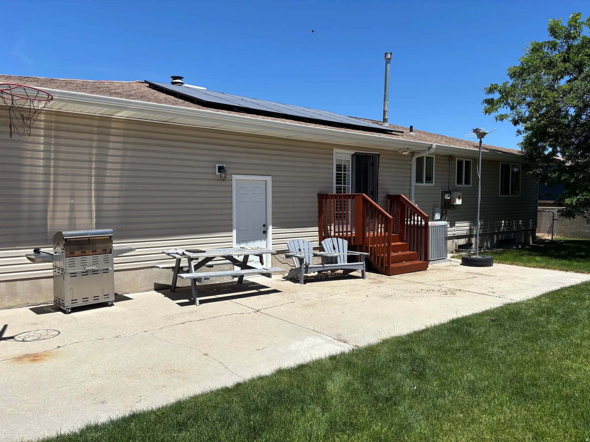 Expansive concrete patio offering direct outdoor access