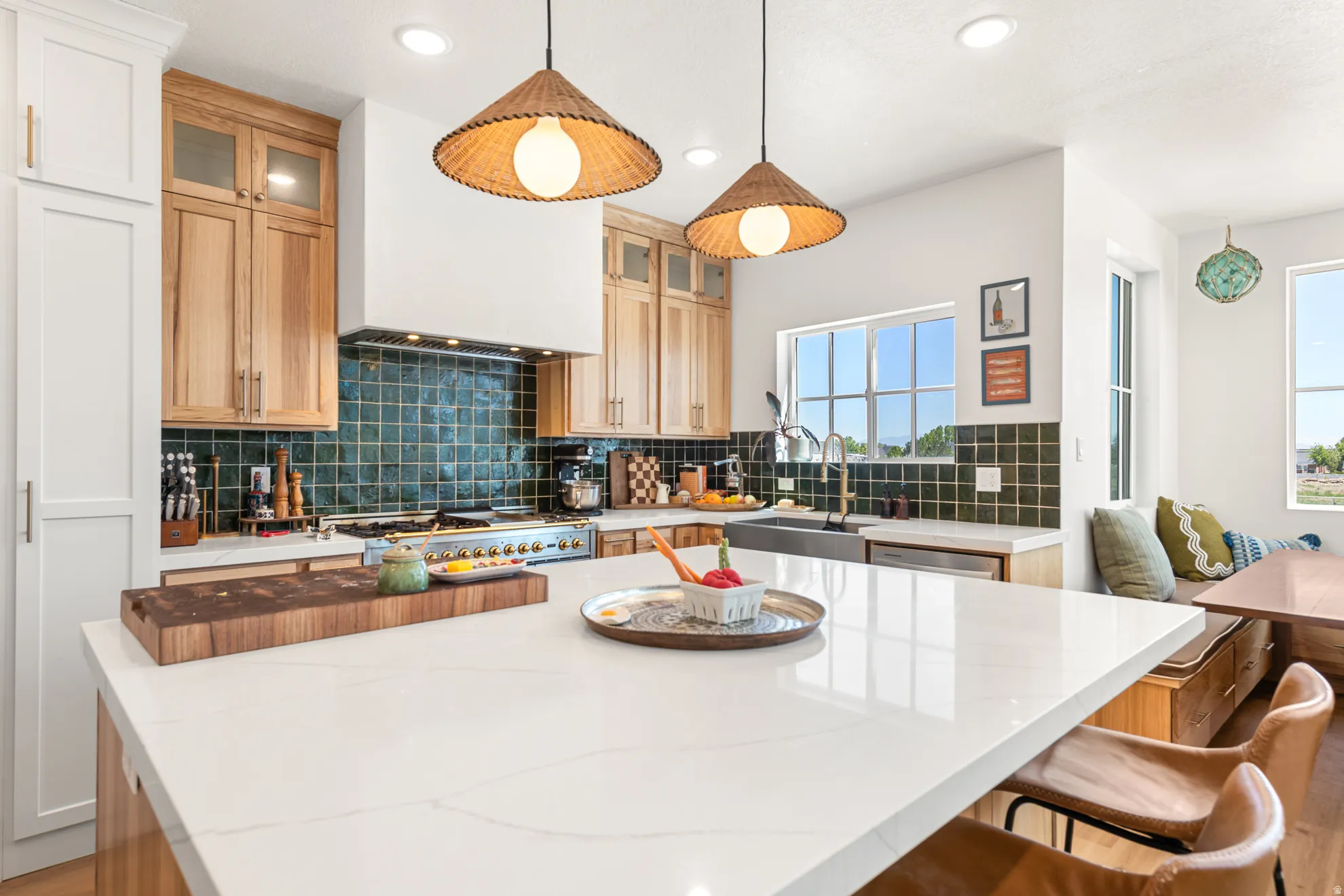 Kitchen featuring a large central island with a quartz countertop, custom wood cabinetry, a tiled backsplash, a built-in range, and recessed lighting