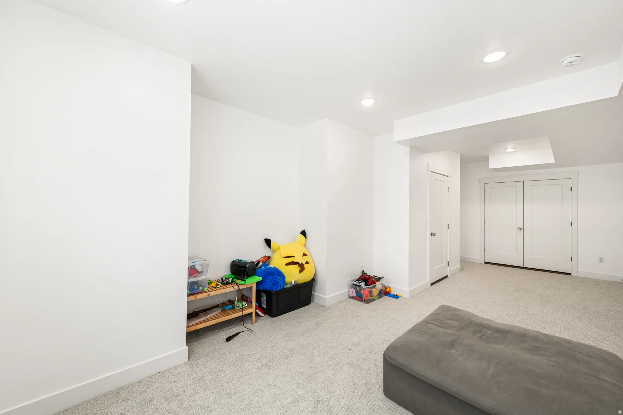 Carpeted interior space with recessed lighting, white walls, and white trim