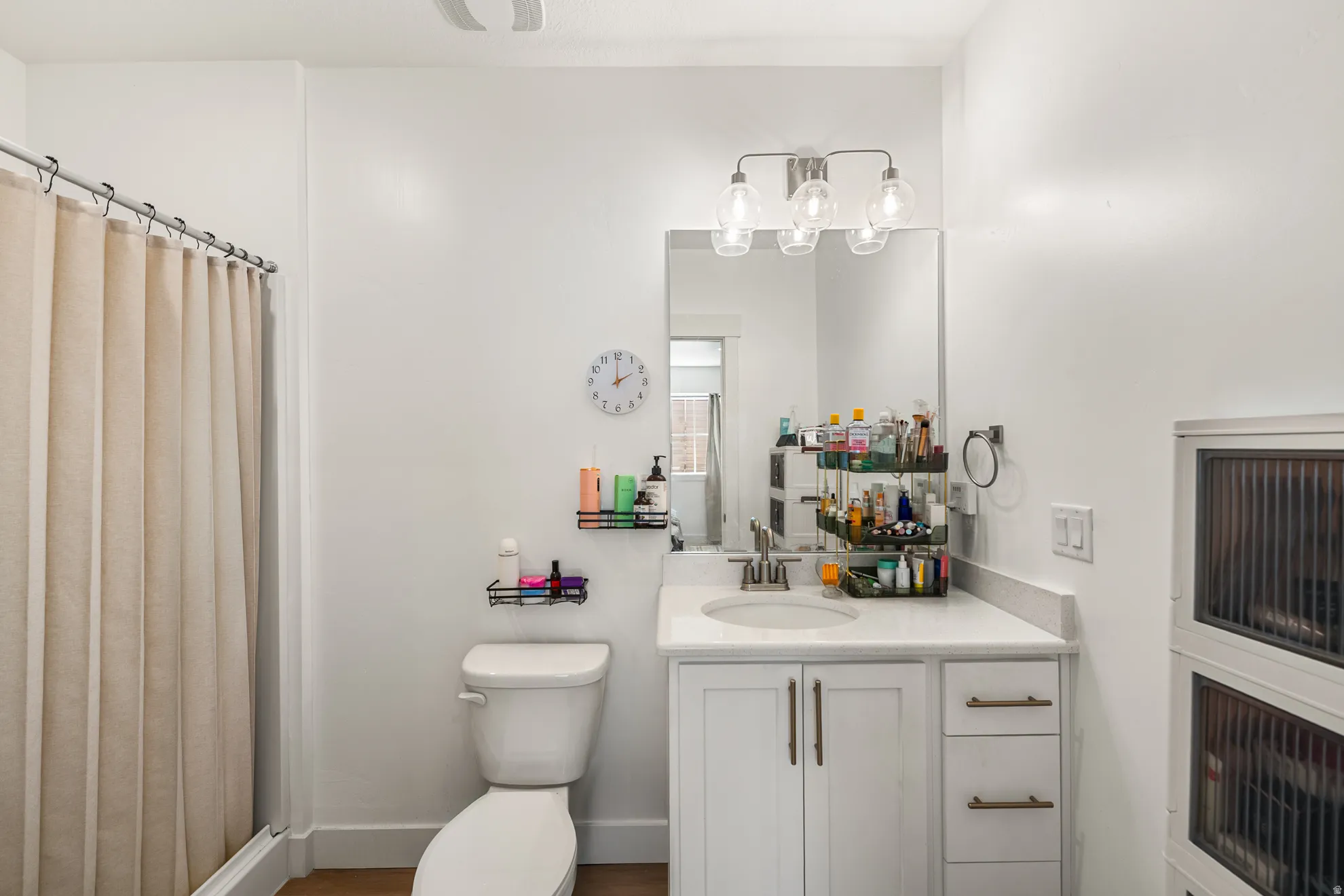 Modern bathroom with a single vanity, undermount sink, and a countertop