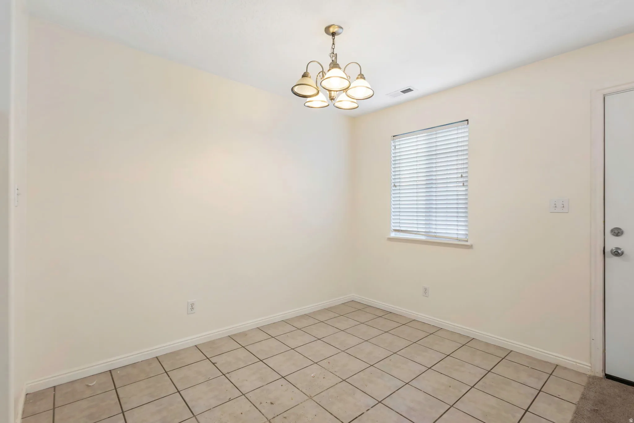 Dining area with tile flooring and neutral wall tones