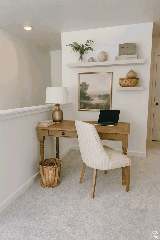 Open office area with light-colored carpeting