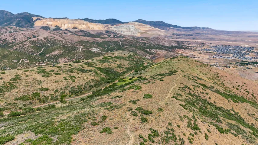 Expansive high-desert terrain featuring varied topography and natural vegetation