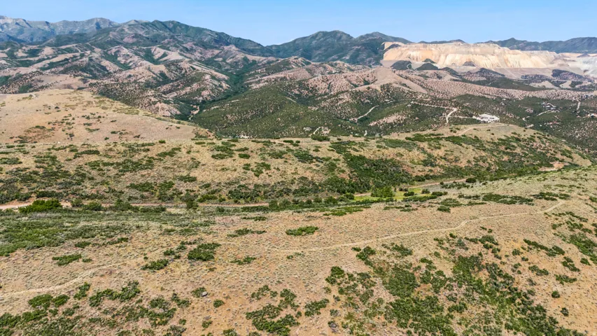 Expansive mountain landscape featuring varied terrain and distant peaks