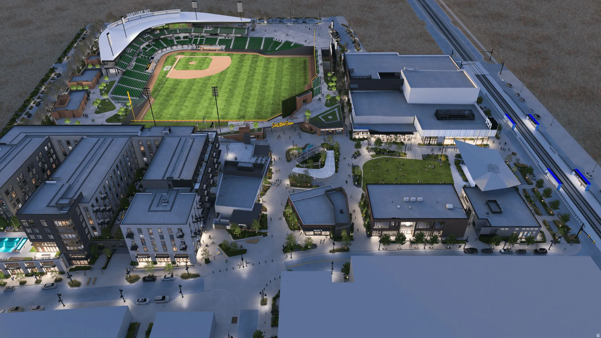 Urban mixed-use development featuring Bees baseball stadium, multi-story residential buildings, commercial retail spaces, and a public plaza with green areas