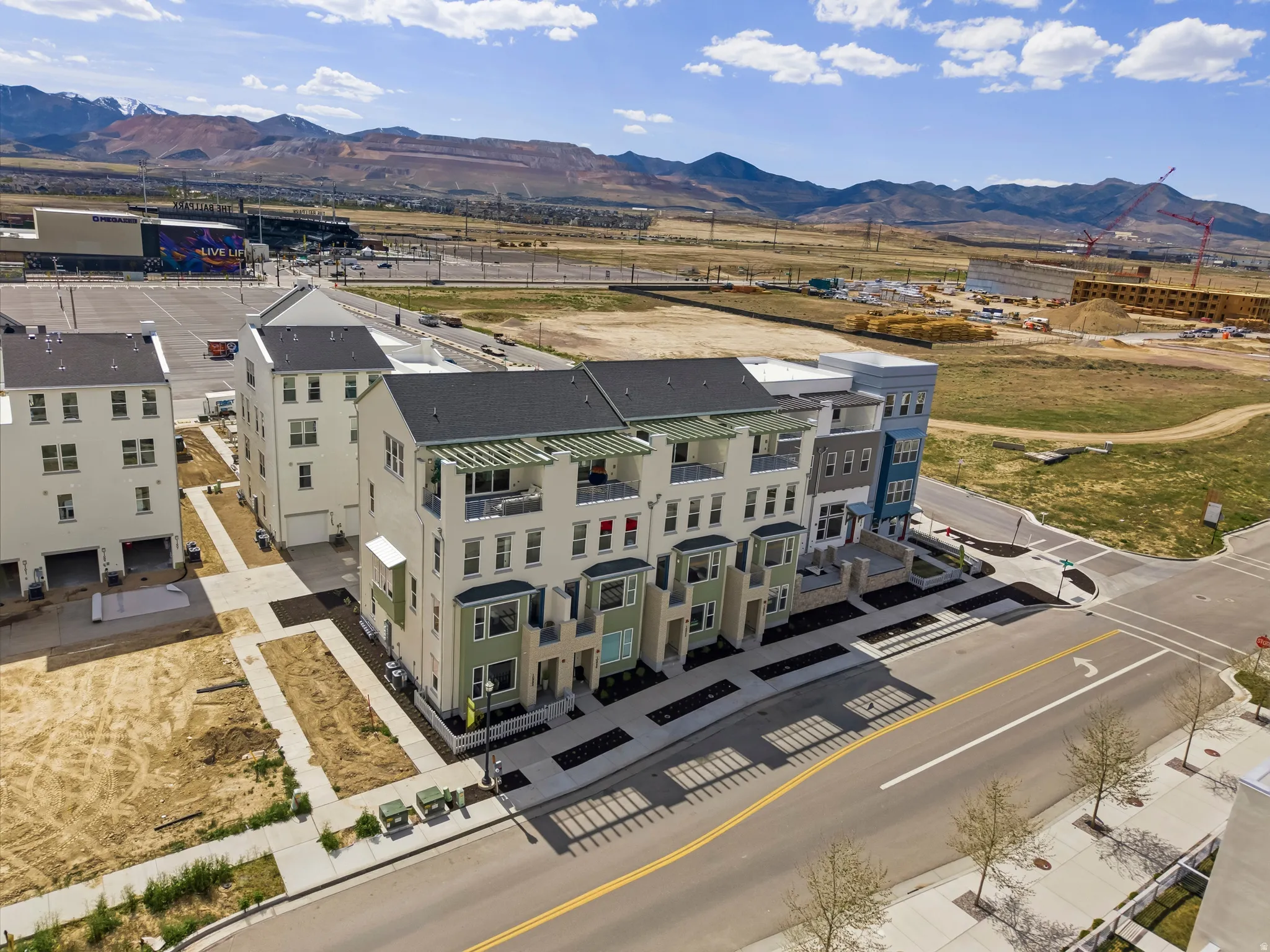 Contemporary townhome-style residences featuring multi-level facades with varying architectural elements