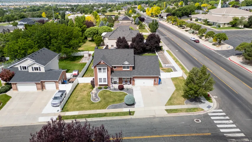 Aerial view of our brick exterior featuring white trim accents and a covered front porch