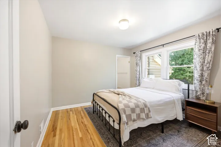 Room featuring hardwood flooring and a neutral color palette