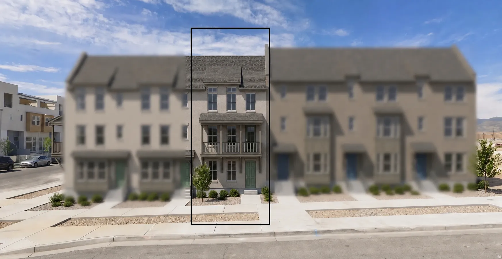 Three-story townhouse featuring a light-colored facade, a covered entry, and a second-story balcony with decorative railings