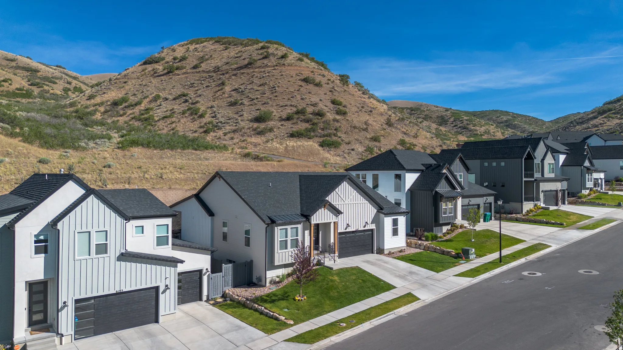 Modern residential architecture featuring a mix of vertical siding and smooth stucco