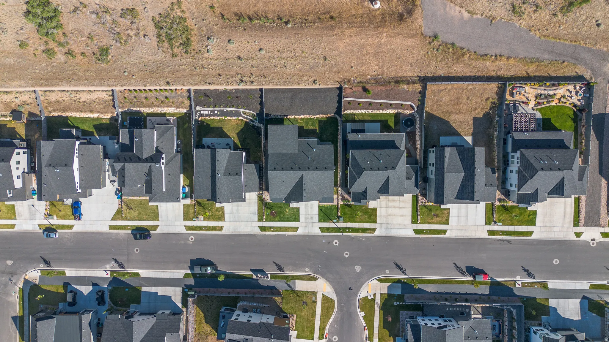 Aerial perspective showcasing a residential development with uniform rooflines