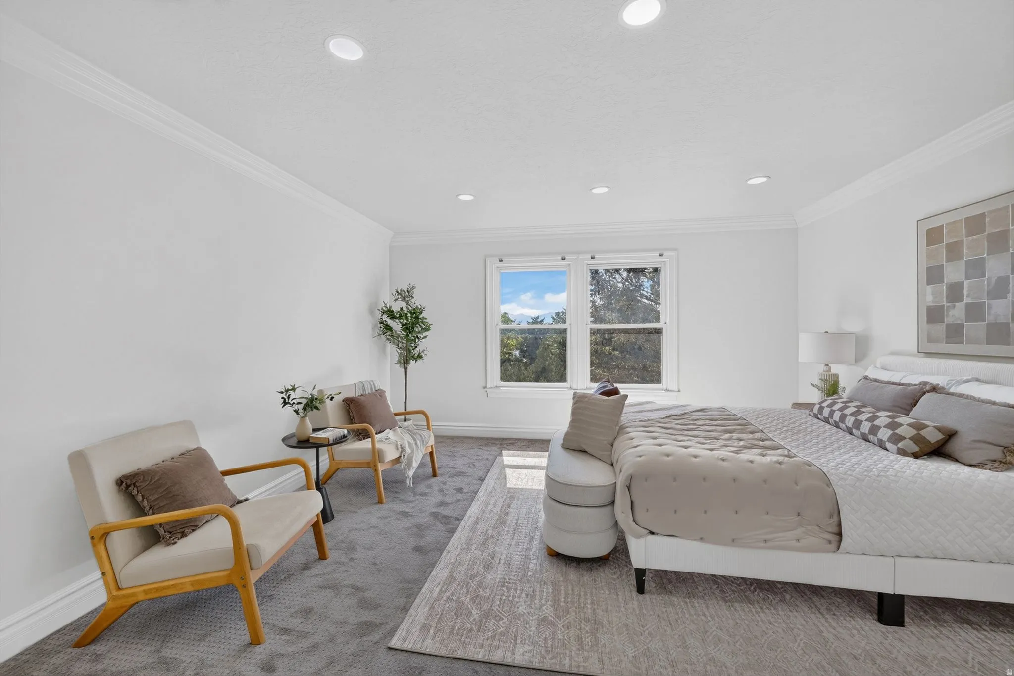Carpeted room featuring a double-paned window, recessed lighting, and crown molding